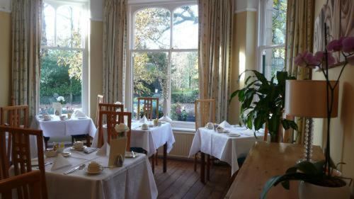 The dining room at Rosemount Guest House, set for breakfast