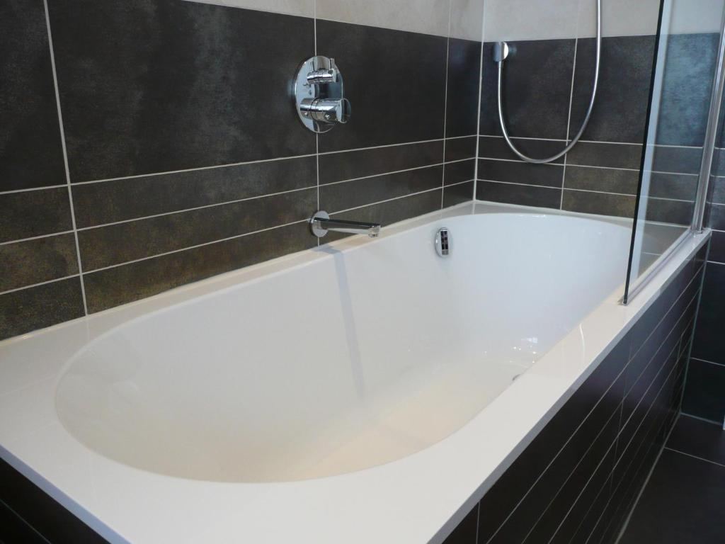 En suite bathroom with bath and shower